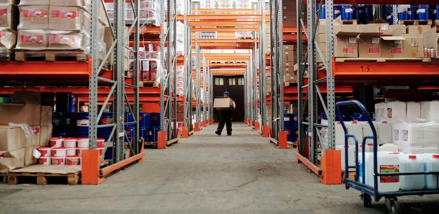 Warehouse aisle stacked with palletised cargo in Georgia
